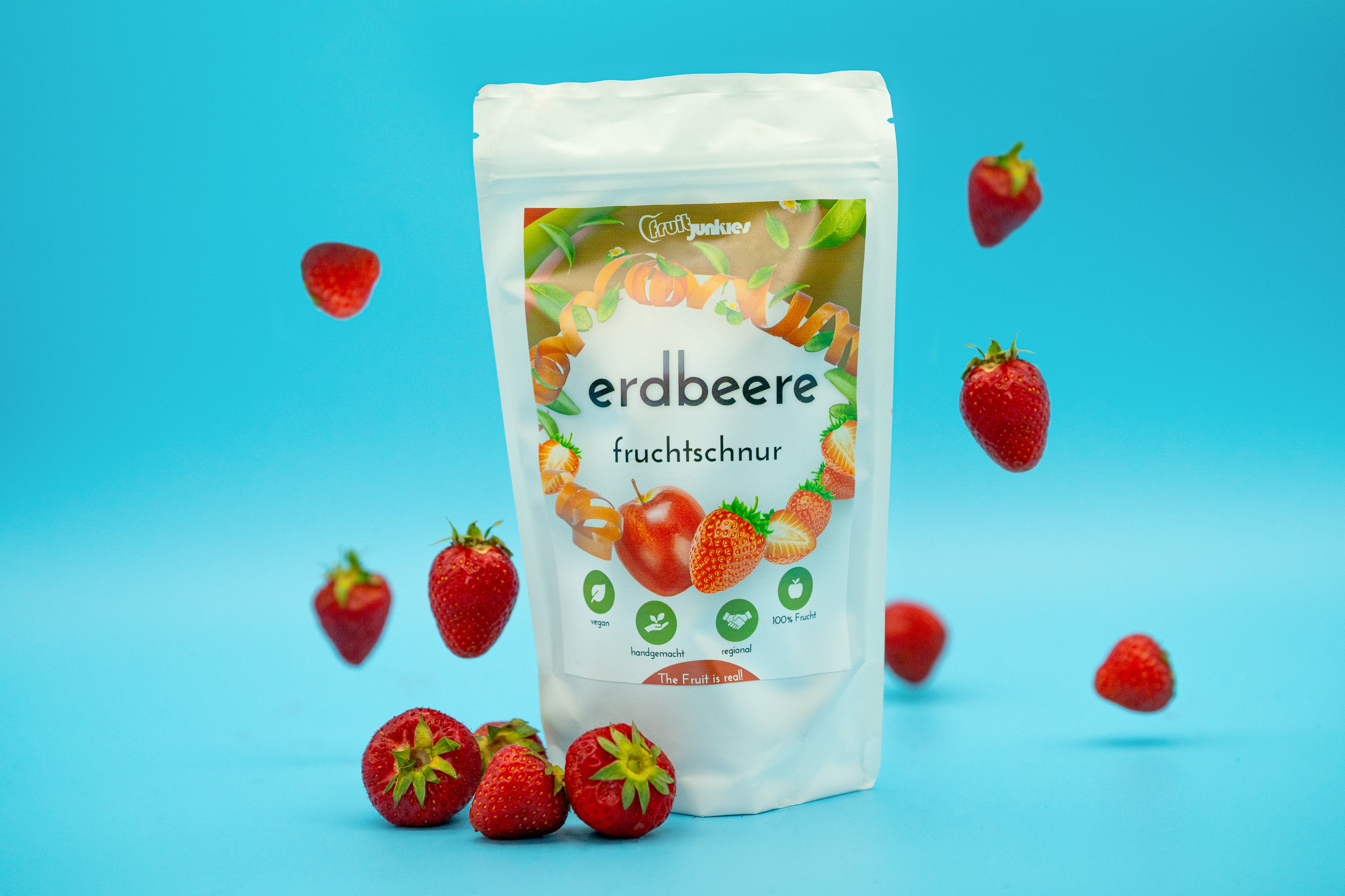 Tüte Fruchtschnur Erdbeere und schwebende Erdbeeren